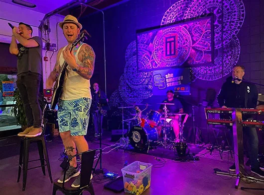 Smoove Series performing live at Tribus Beer in Milford, CT with Joe Scovill singing and standing on chair
